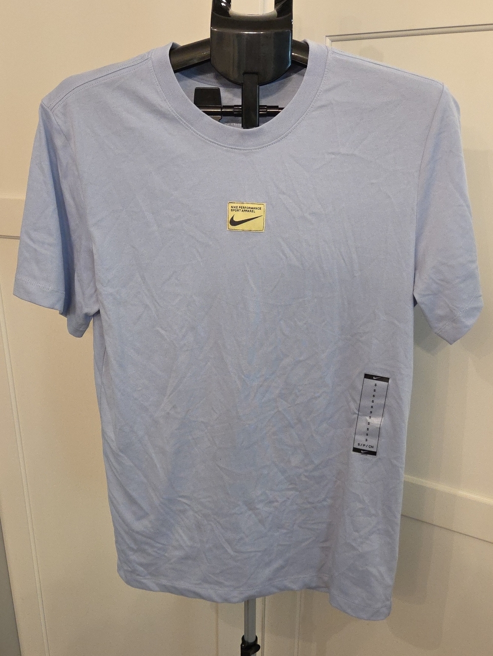 Nike Light Blue Short Sleeve Dry Fit Crew Neck Tee. Small Logo Patch On Front.